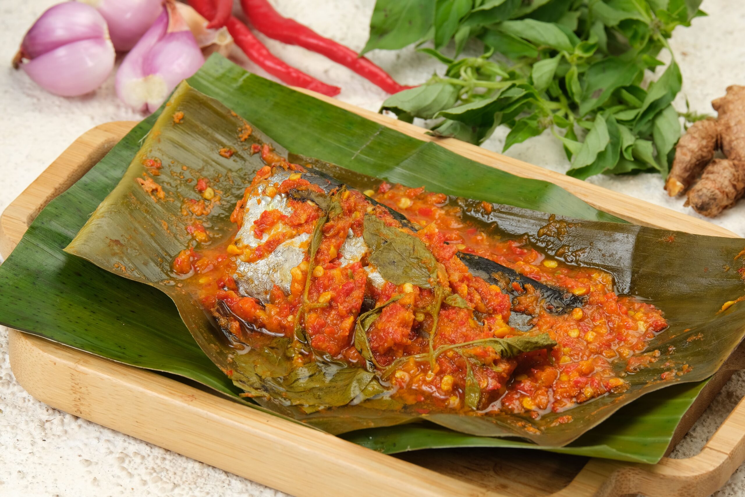 indonesian traditional food pepes ikan (fish pepes)